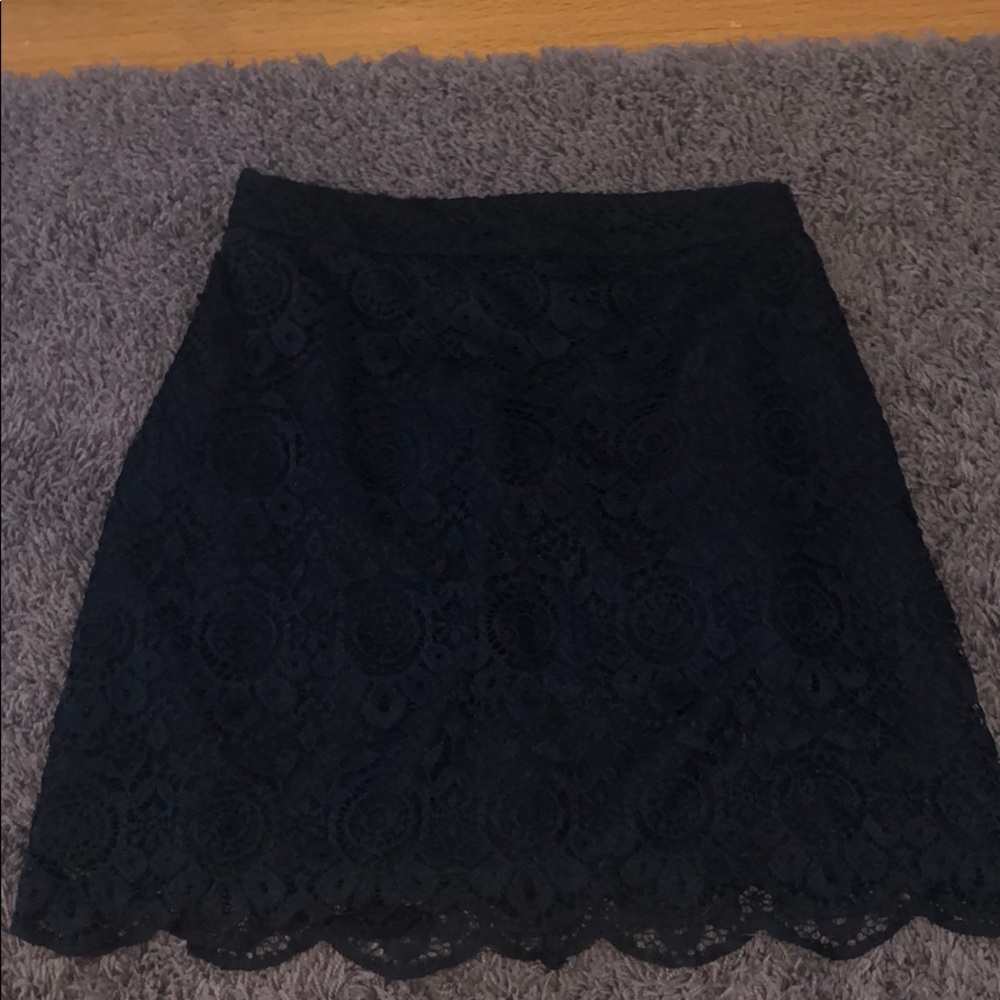 A navy blue 00 zip up skirt, from Hollister
